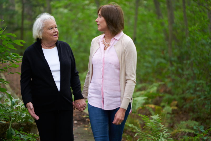 senior woman on a walk with a loved one