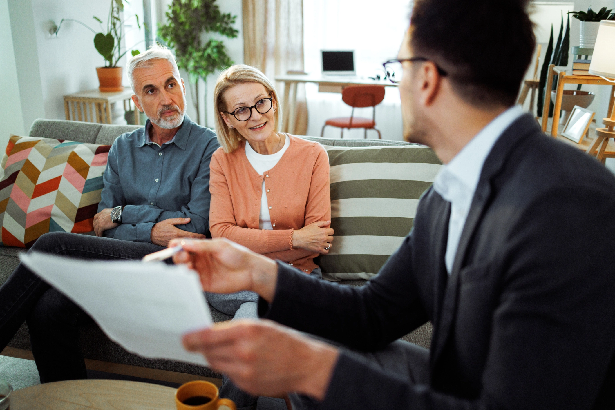 A senior couple talking about Assisted Living costs in Michigan and planning for retirement at Burcham Hills.